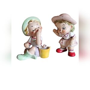 Vintage boy and girl figurines. "A kiss for a fish" set
